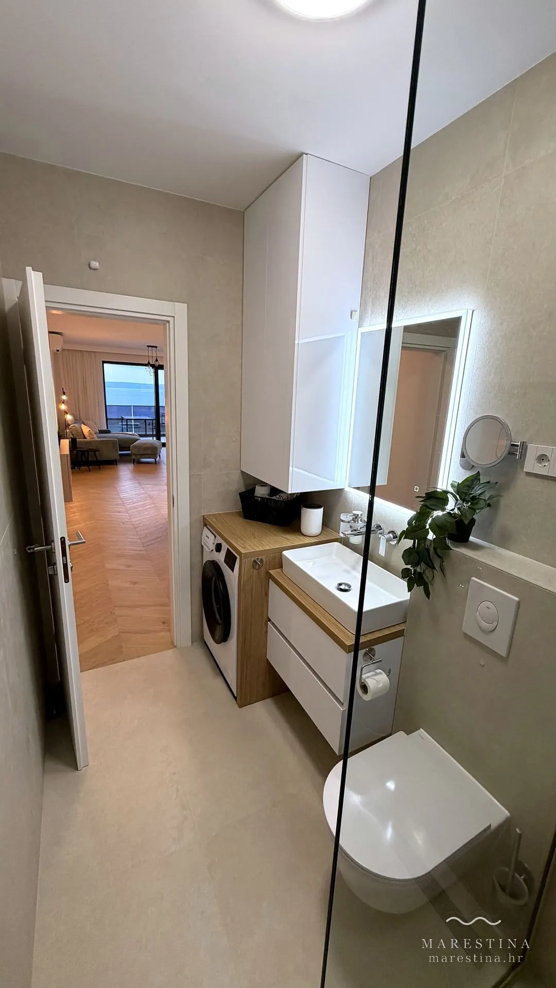 Second bathroom with walk-in shower and washing machine