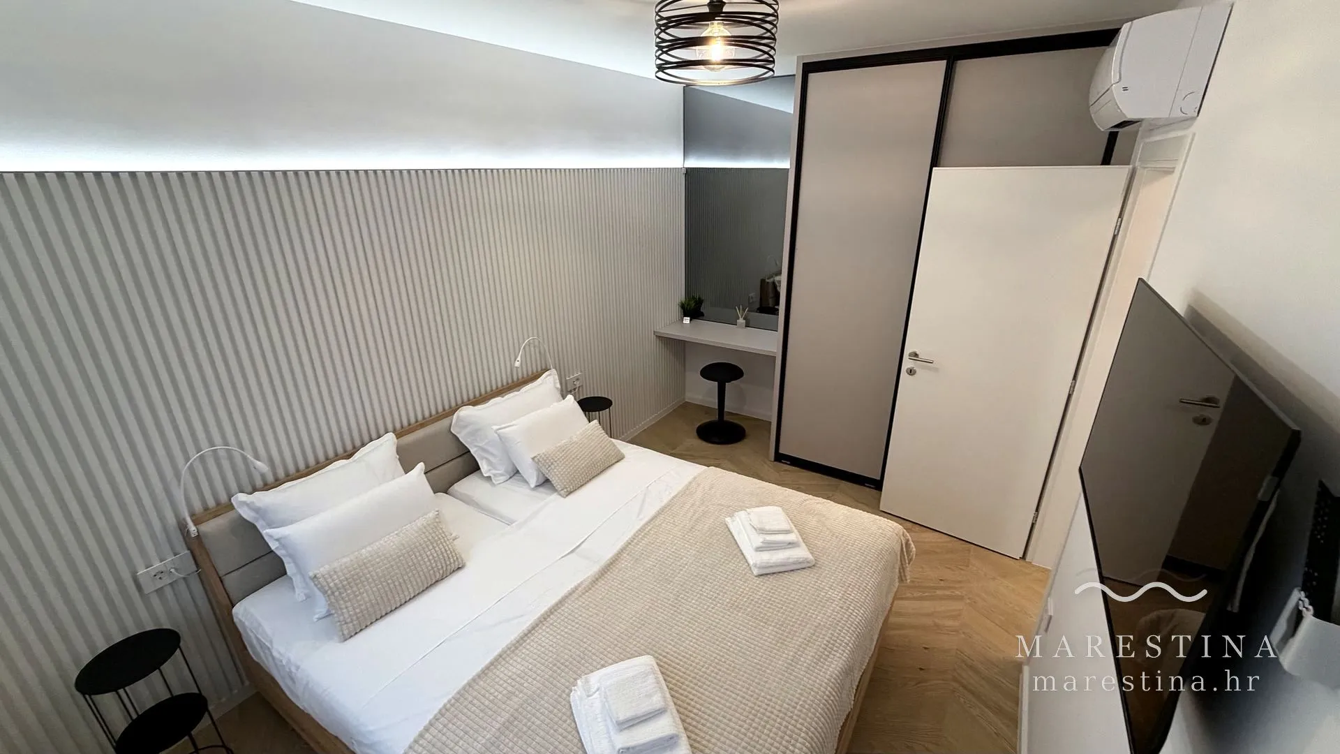 Second bedroom with double bed, wardrobe and workspace