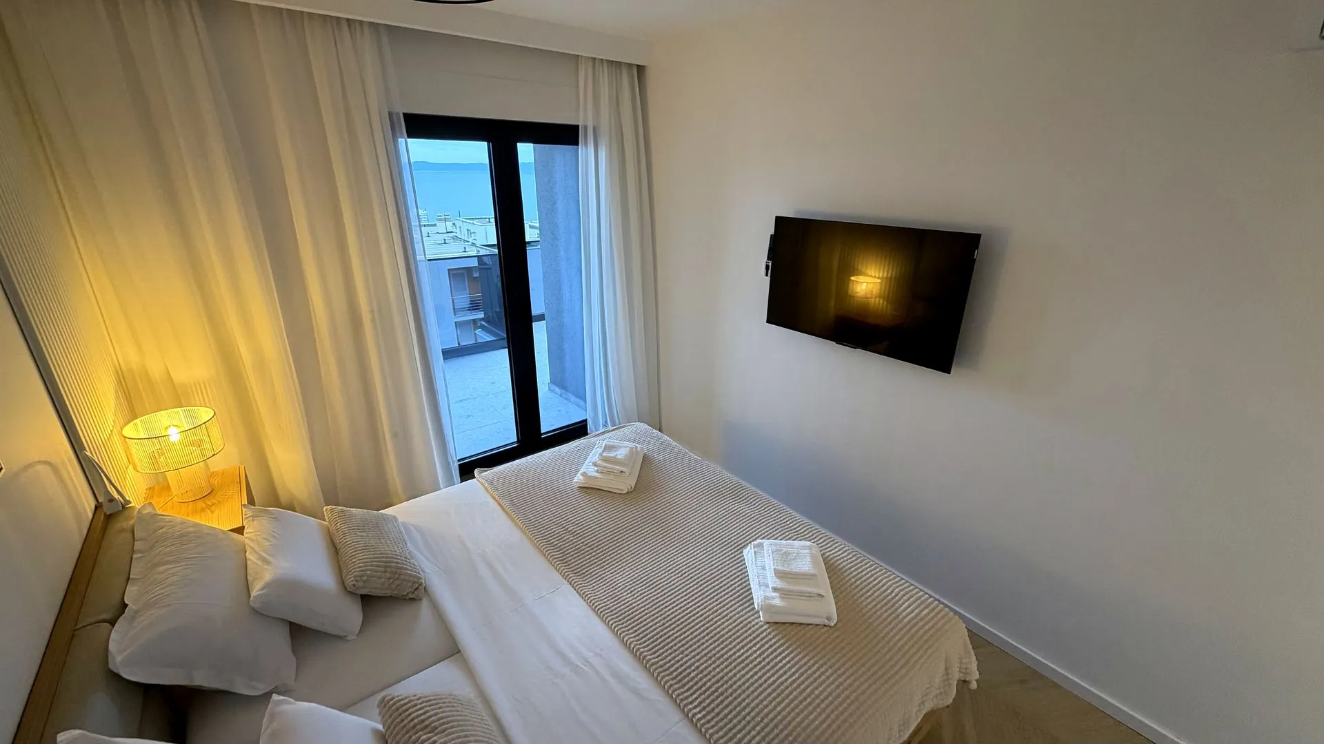 Main bedroom with double bed and balcony access